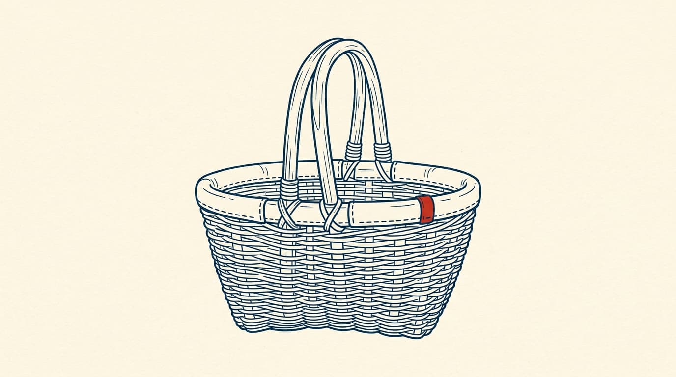A woven wicker basket with a curved wooden handle and a leather-bound rim.